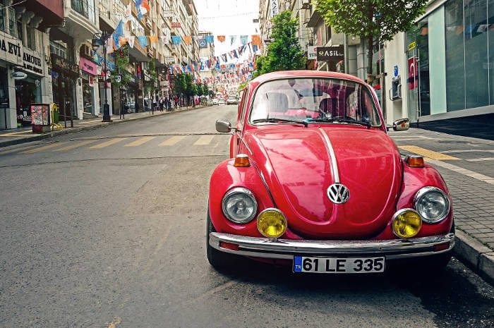 red-car-in-european-city